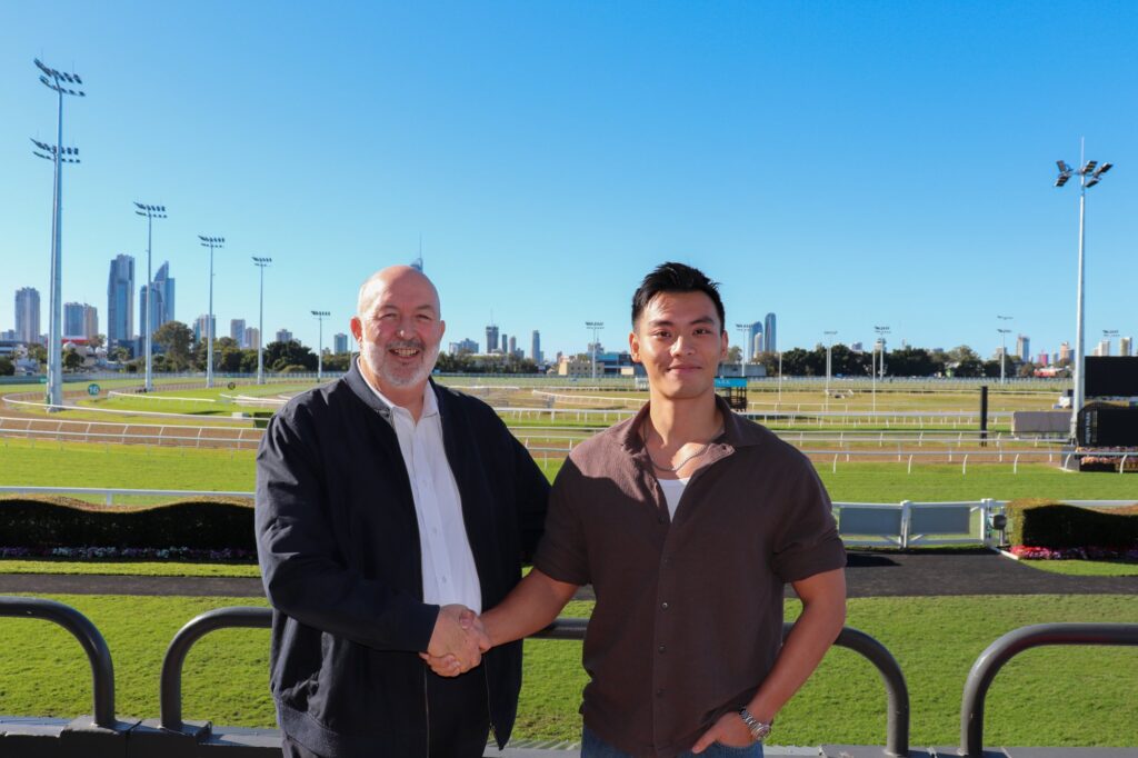 Steve Lines and John Fung shaking hands at the Gold Coast Turf Club