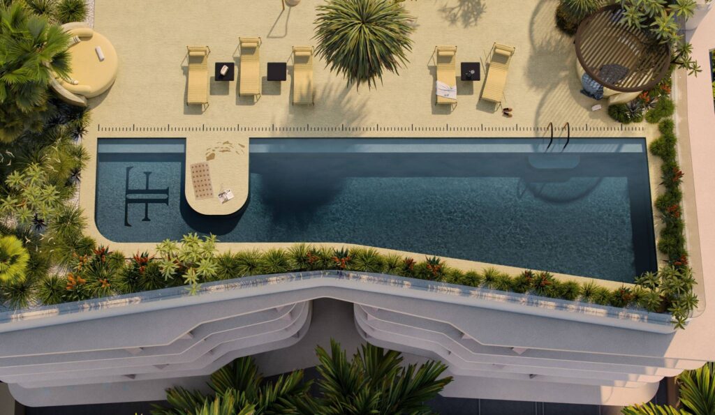 Architectural rendering of the rooftop pool of The Frederick project viewed from above showing landscaping and sun lounges