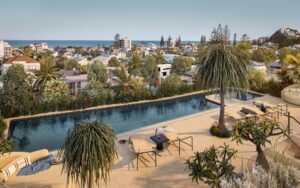 Architectural rendering of the rooftop pool area of The Frederick project with ocean views towards Nobby Beach