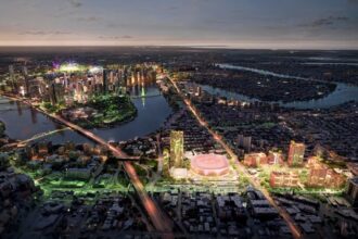 Architectural rendering of the proposed Gabba Entertainment Precinct showing the new indoor arena and surrounding mixed-use development integrated with Brisbane’s skyline and river network.