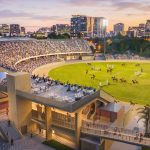 The upgraded Main Arena at dusk, with an equestrian event on the showring. Artist impression via Delivering 2032.